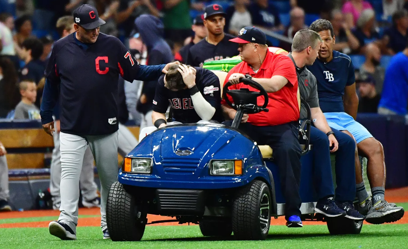 Tyler Naquin being carted off Rays Field after collision.