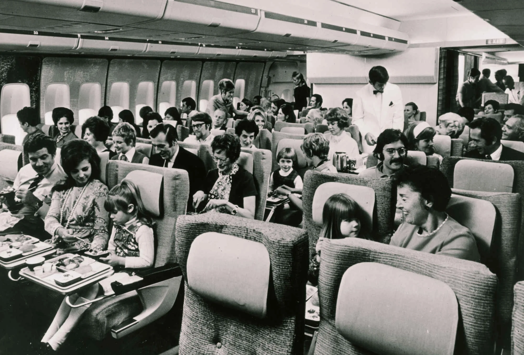 From a time when people traveled with less luggage—note the overhead bins. (image credit: NPR , via SuperCompressor)