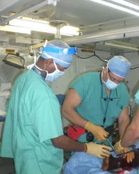 Dr. Dean Lorich, right, operating in Haiti.