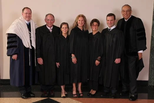 Lilly Julien (center) with the Joseph family and Rabbi Aaron Panken (left) and Chairman Irwin Engelman (right).