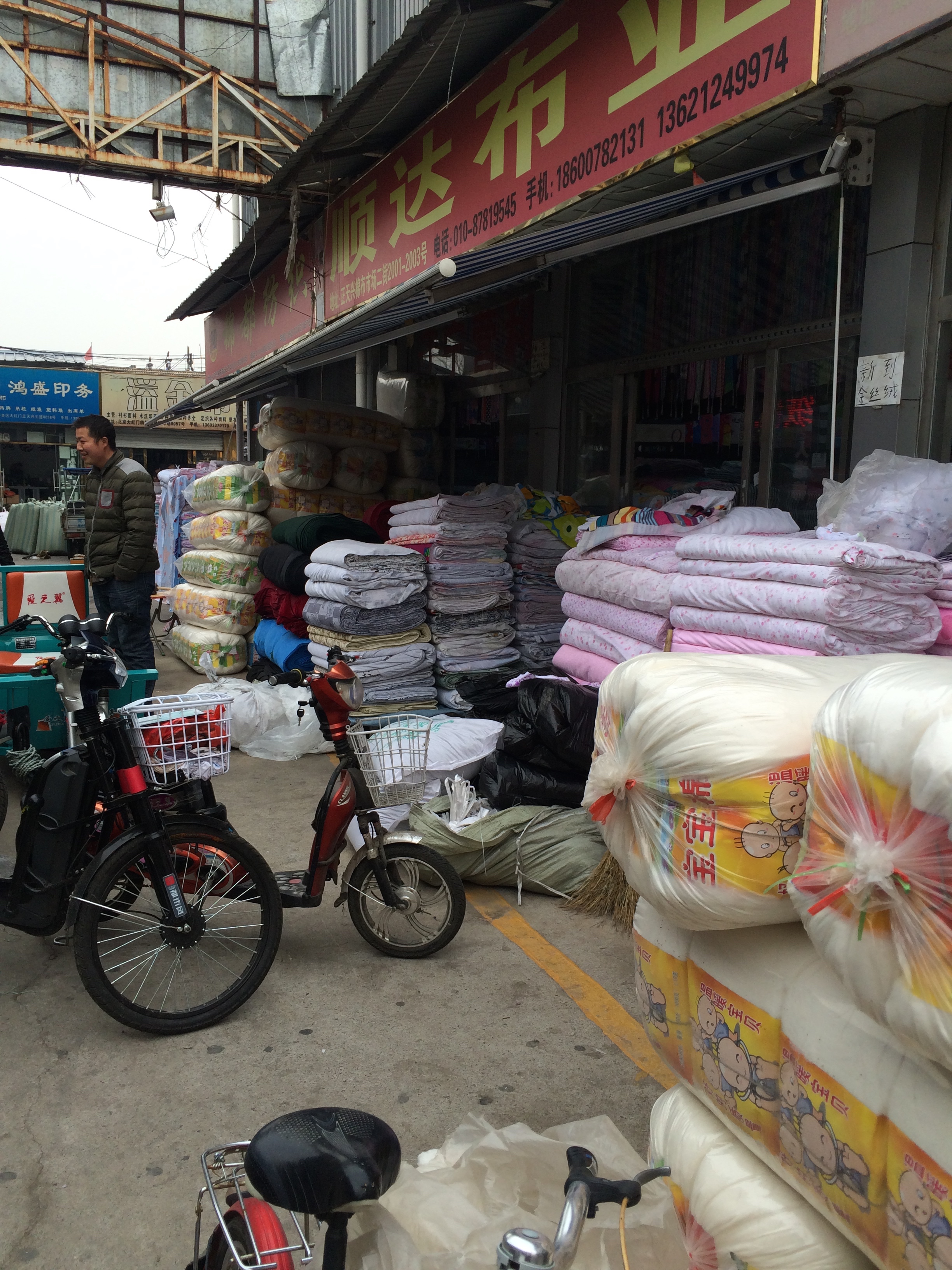 Annoyingly I didn't take a single picture of the electronics markets in Beijing, so this is a picture in the wholesale fabric market I also visited, but didn't write about.