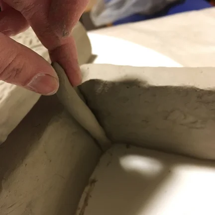 Making sure the corners can hold the weight of the plaster.