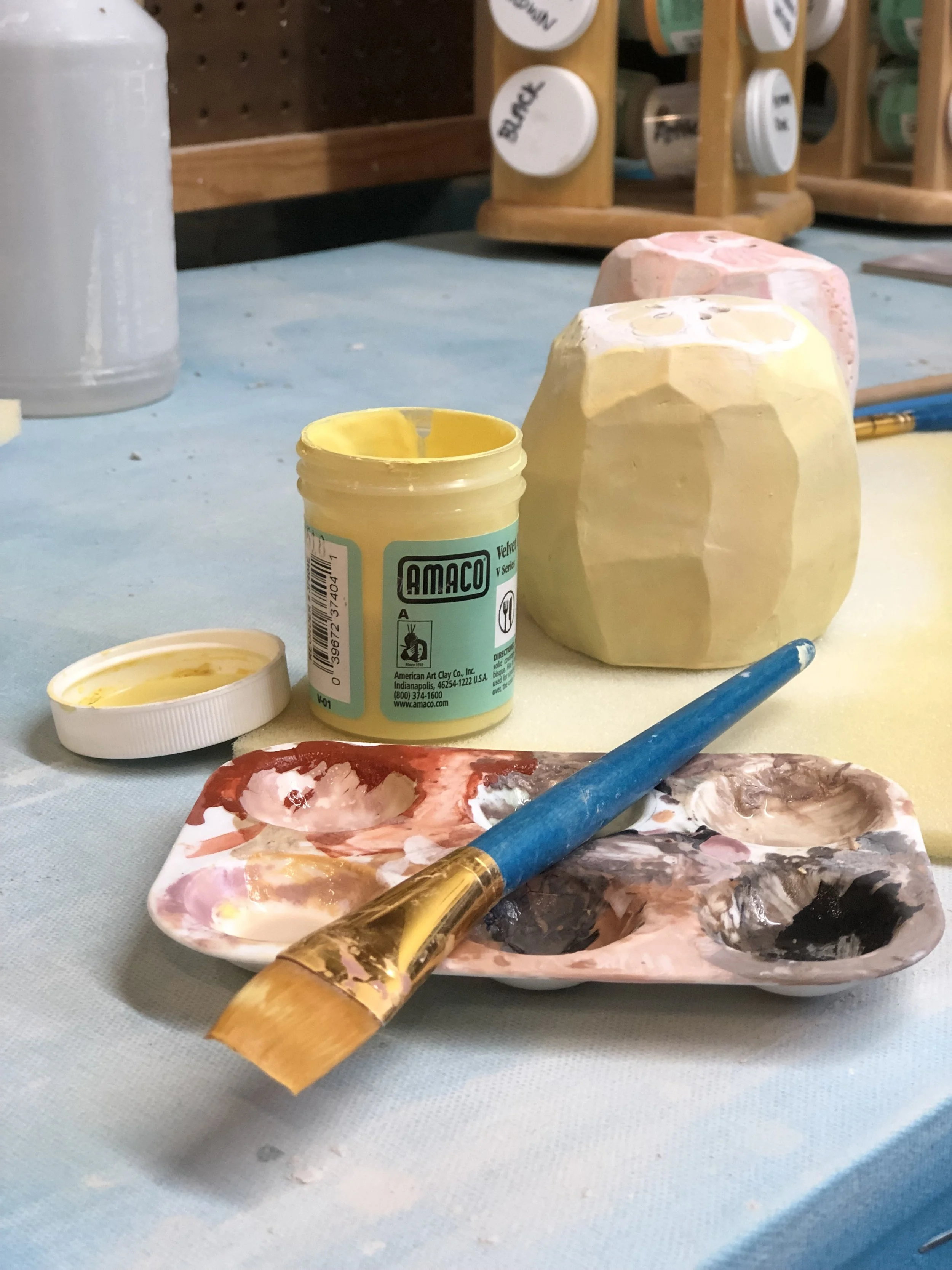 Salt and pepper shakers in progress, using AMACO V-308 Yellow Underglaze.