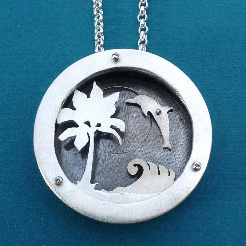 Extra large four layer shadowbox necklace with spinning dolphin.
