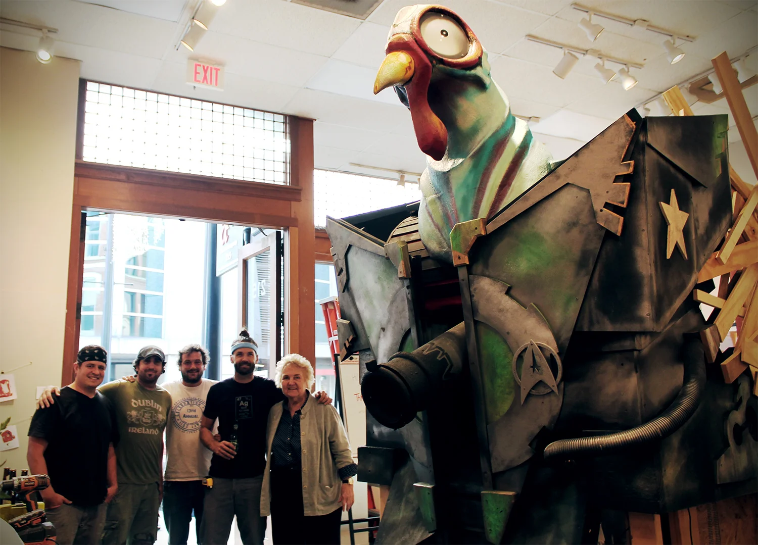 From left to right: Brian Somerville, Sean Perdue, Trey Gossett, Jason York, Owner Anne Brown, with Tank Chicken