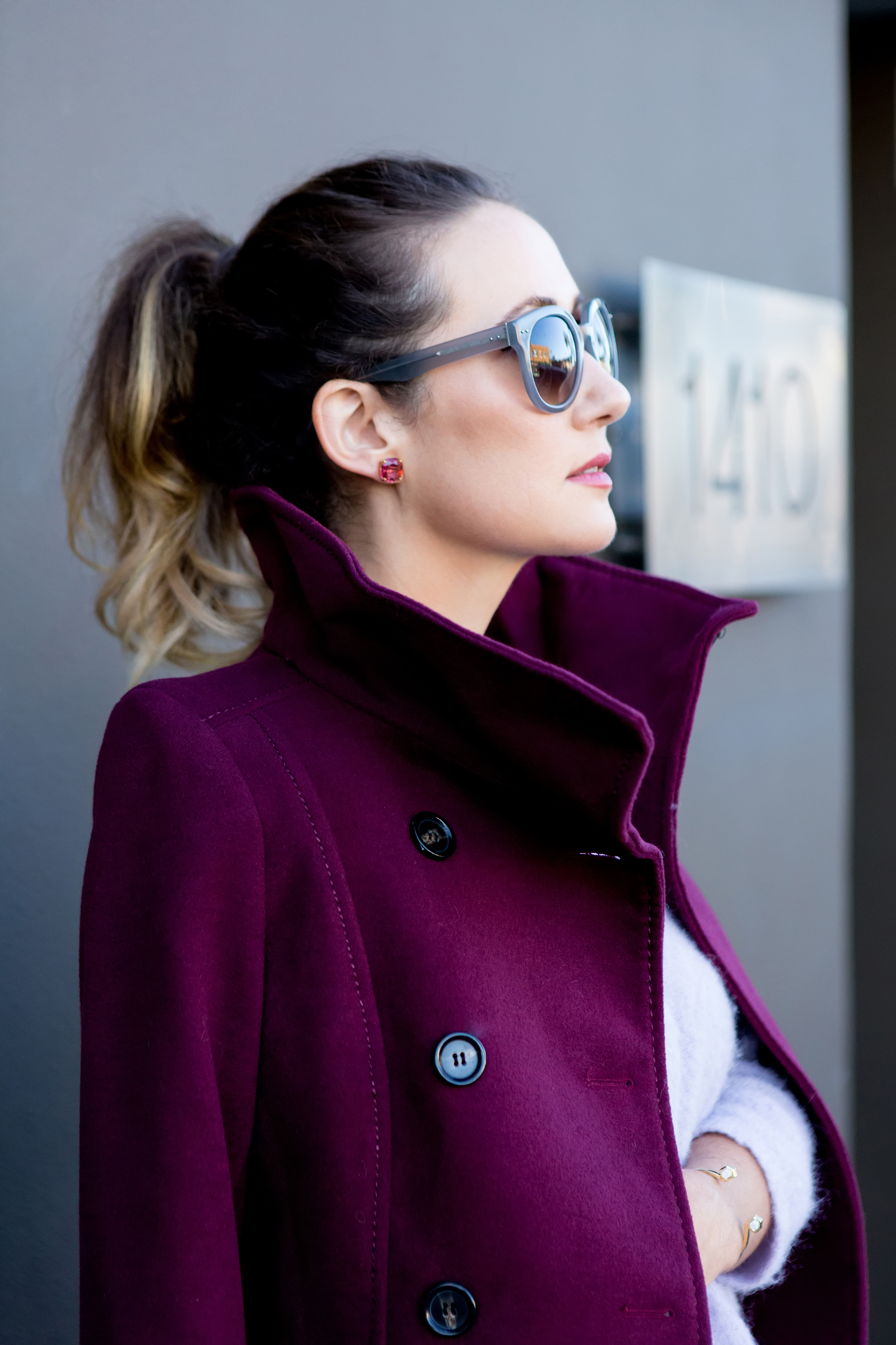 Coat, H and M . Sunglasses, Linda Farrow Luxe. Earrings Kate Spade NY . Chrysalis Cuff, House of Harlow 1960