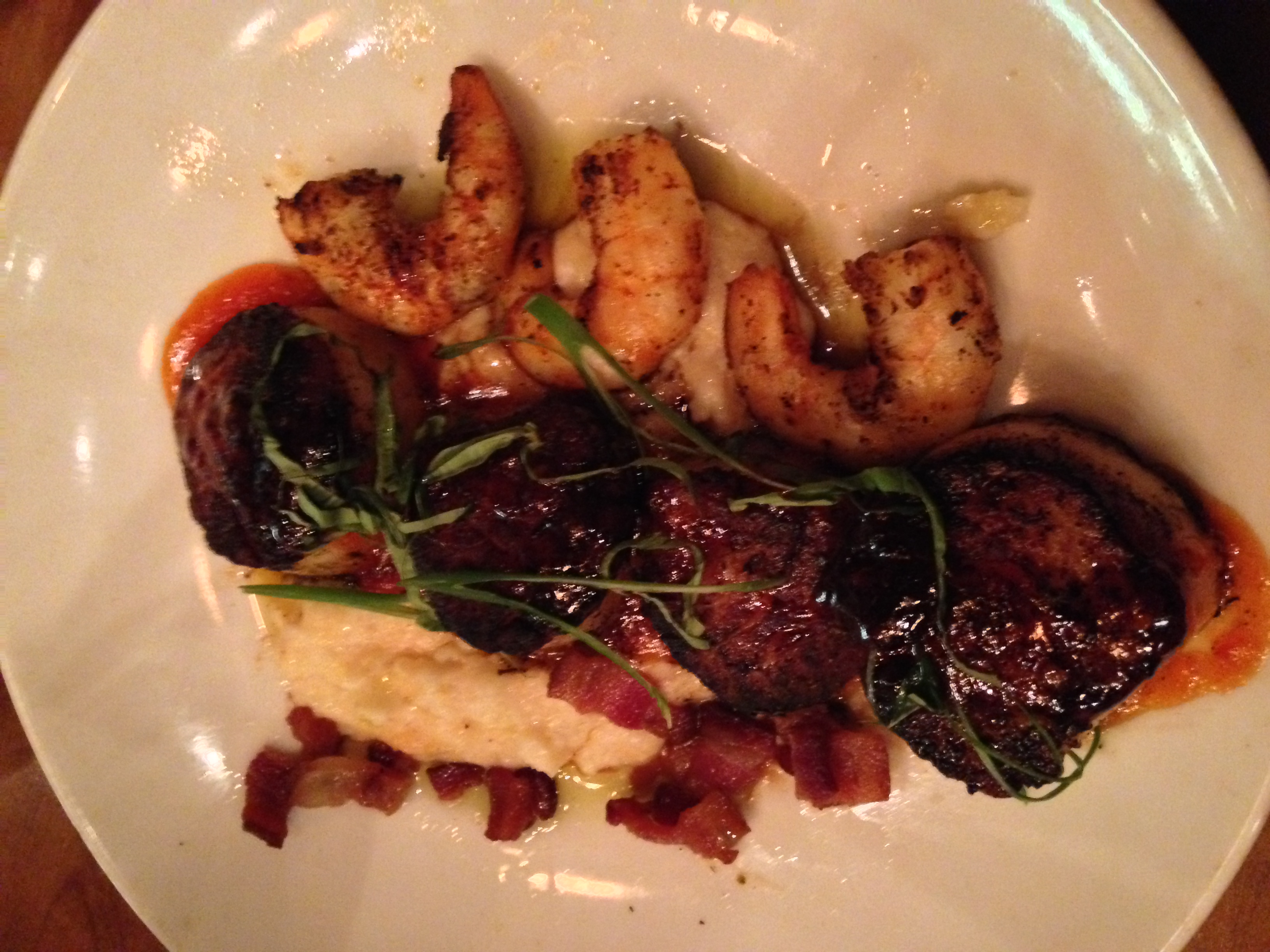 Fancy shrimp and grits at Kingfish on Chartres. &nbsp;Taken with my iPhone right before I inhaled. &nbsp;I will spend the rest of my life chasing the caramelization (is that a word?) on these scallops. &nbsp;