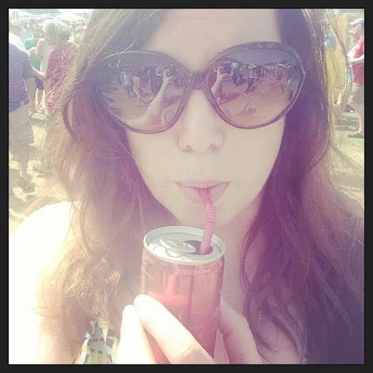 During my absence from the Fairgrounds that host Jazzfest, they started serving Sophia sparkling wine in a can. &nbsp;I assume, to draw me back in. &nbsp;Well, it worked. &nbsp;Taken with my iPhone while surrounded by the light of the hot afternoon …