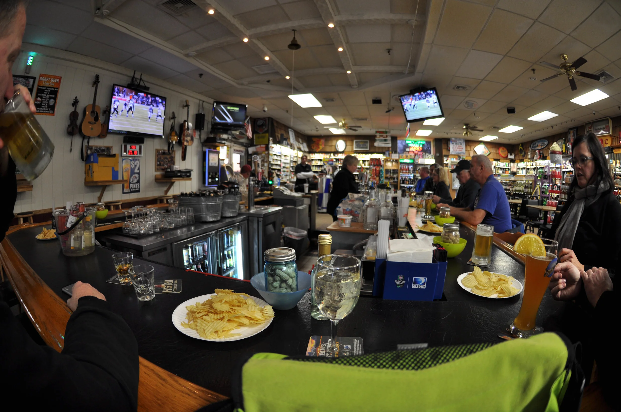 Here is a fisheye shot of a bar in a liquor store where the bartenders bring sour cream and onion dip for the patrons just to be sweet. &nbsp;IT'S A LOT TO TAKE IN, RIGHT??