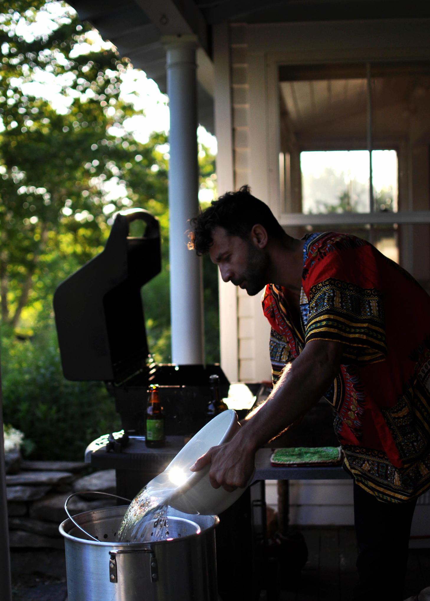 Something about the dashiki and the light bouncing off the water make him look a little angelic I think. &nbsp;