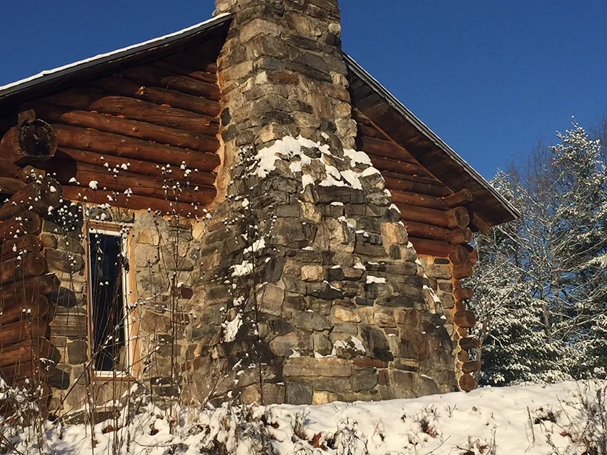 It's cold but clear in this shot of Larry Chadwick's hand built cabin. The fireplace and chimney was constructed from rocks found on Larry's property while building the main structure.