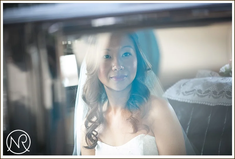 Beautiful bride looking out of car window