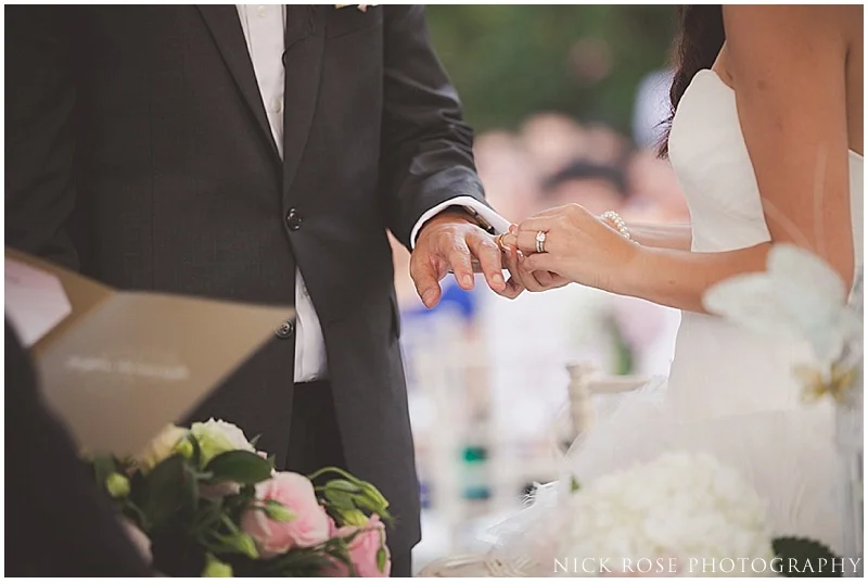 Bride and groom exchanging rings in Singapore