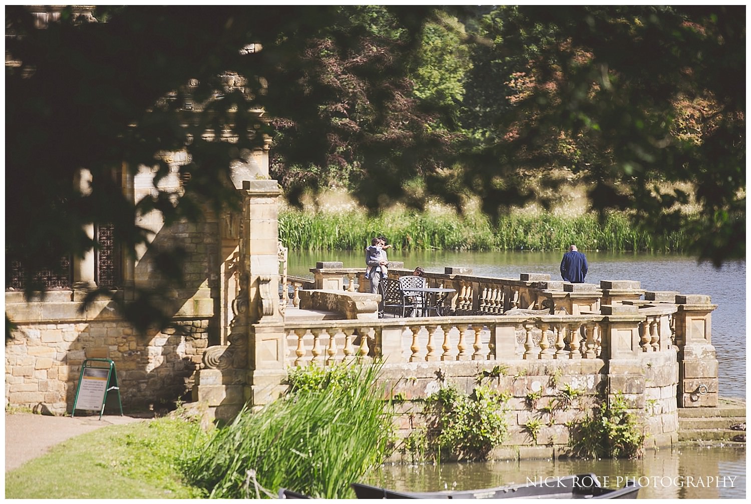 Outdoor summer wedding by the lake at Hever Castle in Kent 