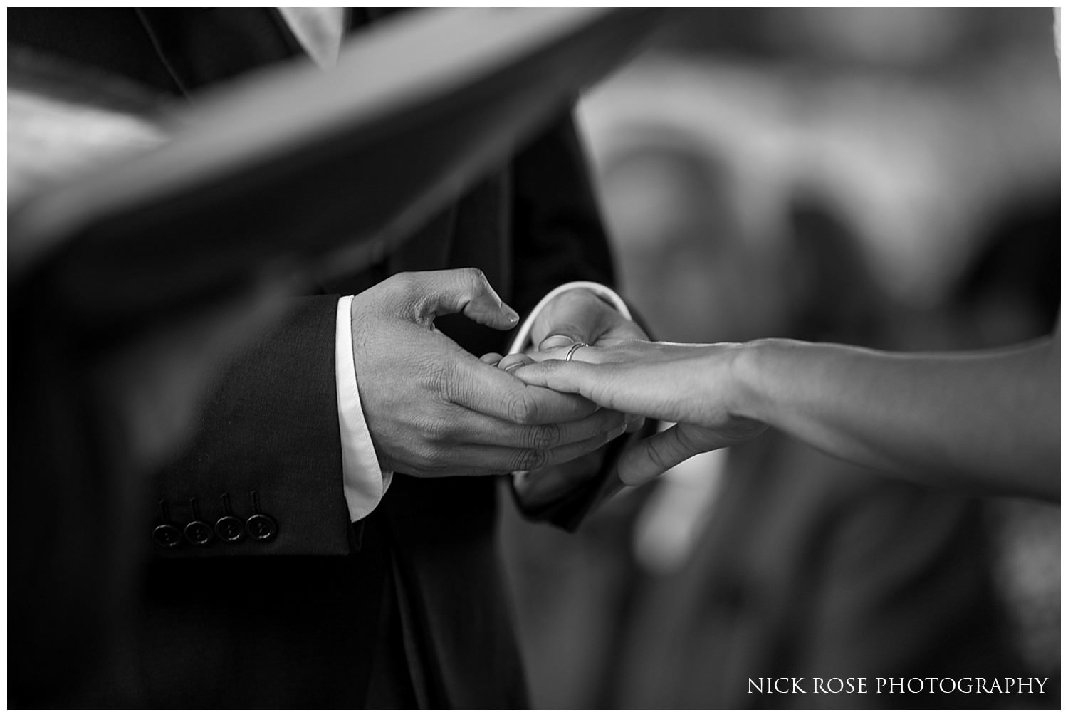  Bride and groom exchanging rings at a Hever Castle Wedding ceremony 