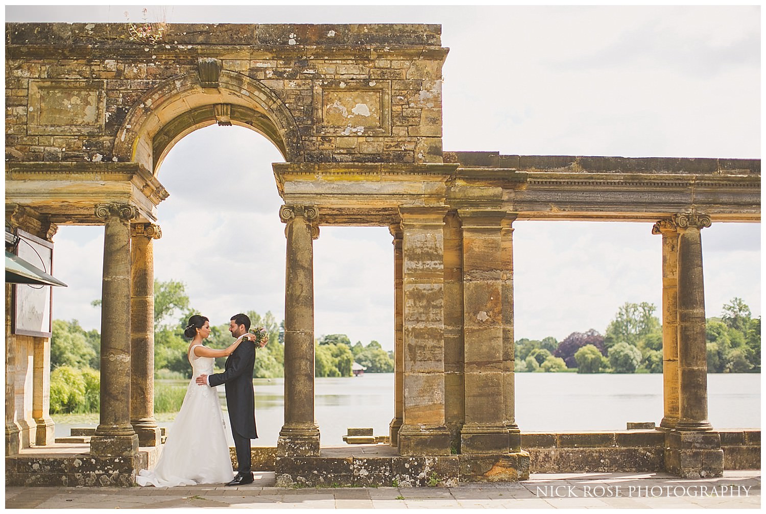  Bride and groom wedding portrait photograph by the lake at Hever Castle 