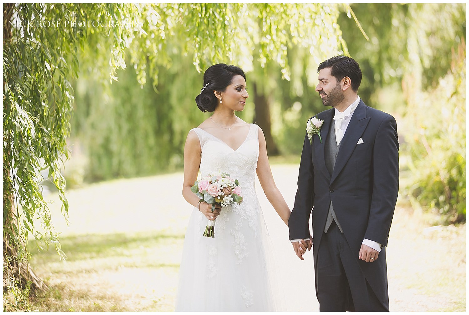  Bride and groom wedding portrait photograph under a willow tree at Hever Castle Kent 