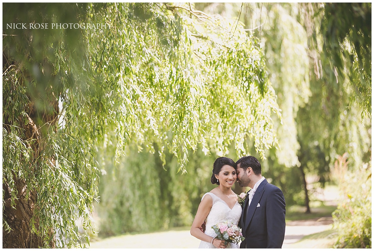  Wedding photograph under a willow tree at Hever Castle Kent 