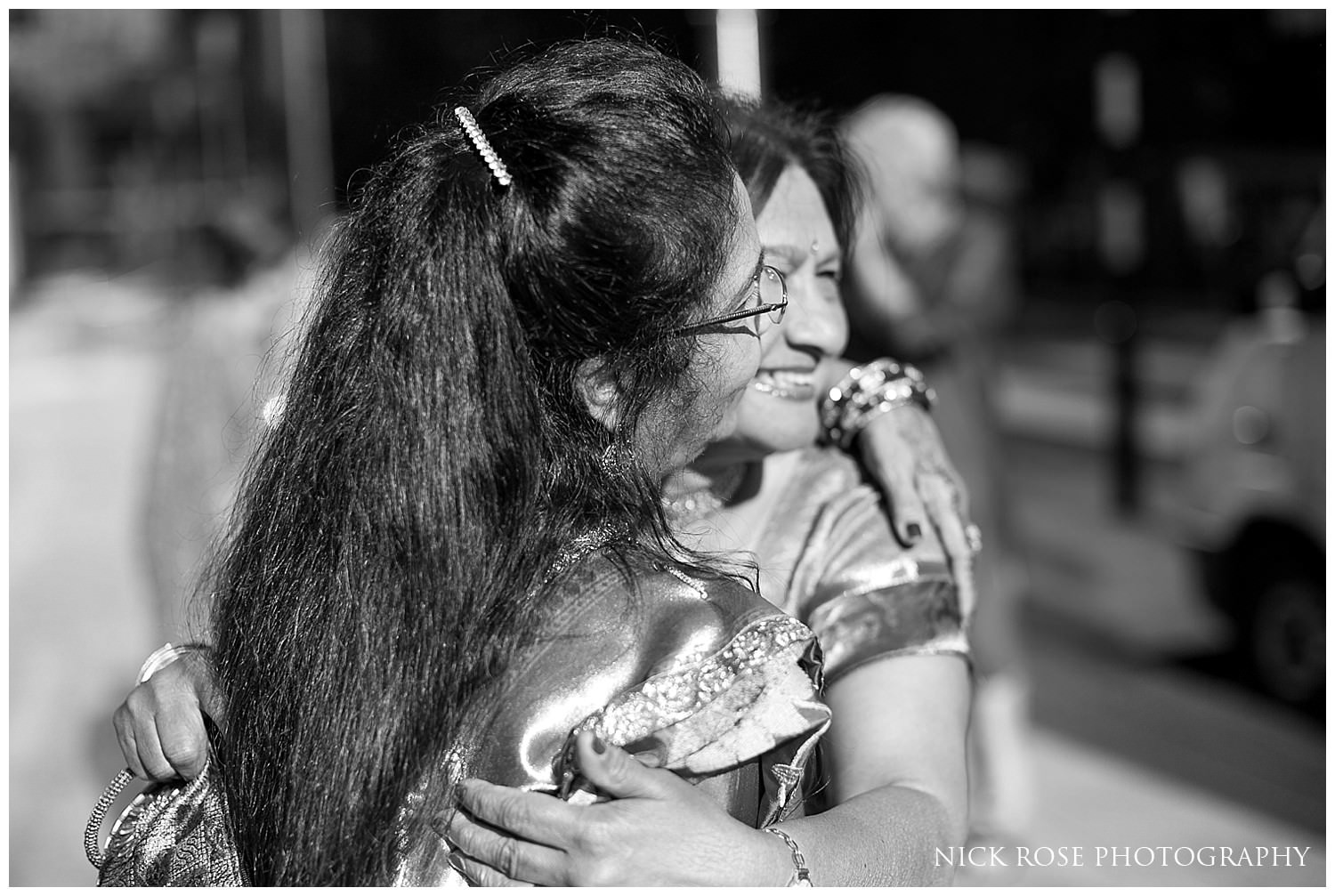  Indian wedding guests outside East Wintergarden wedding in Canary Wharf London 