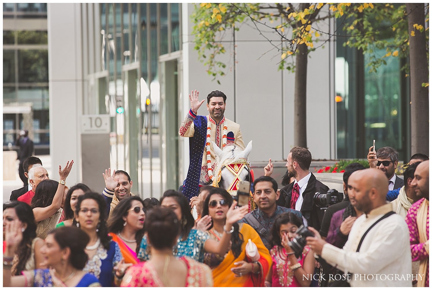 Hindu Baraat and the groom's Indian wedding entrance on a horse in Canary Wharf London 
