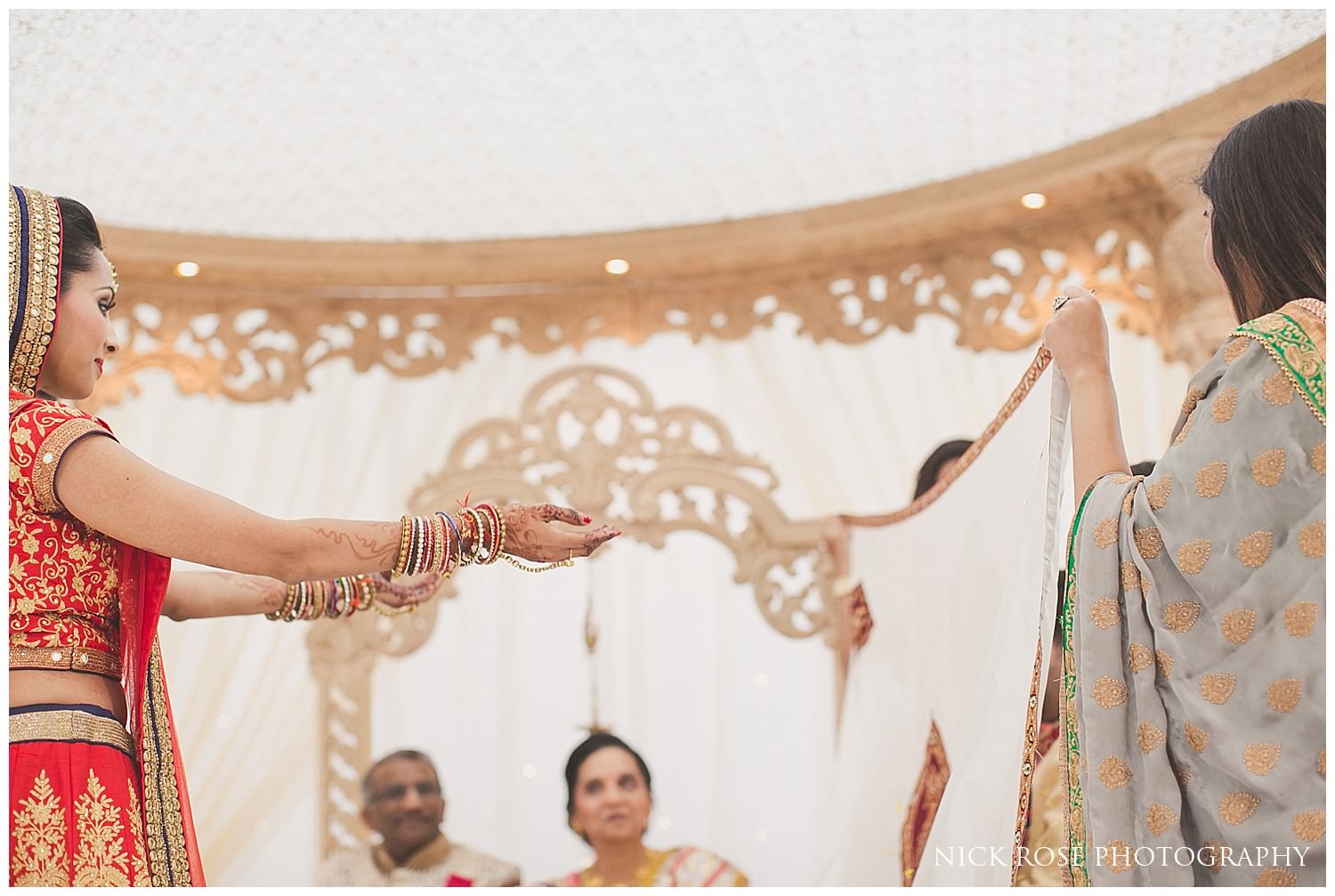  Bride ceremony reveal at East Wintergarden during a Hindu wedding in Canary Wharf London 