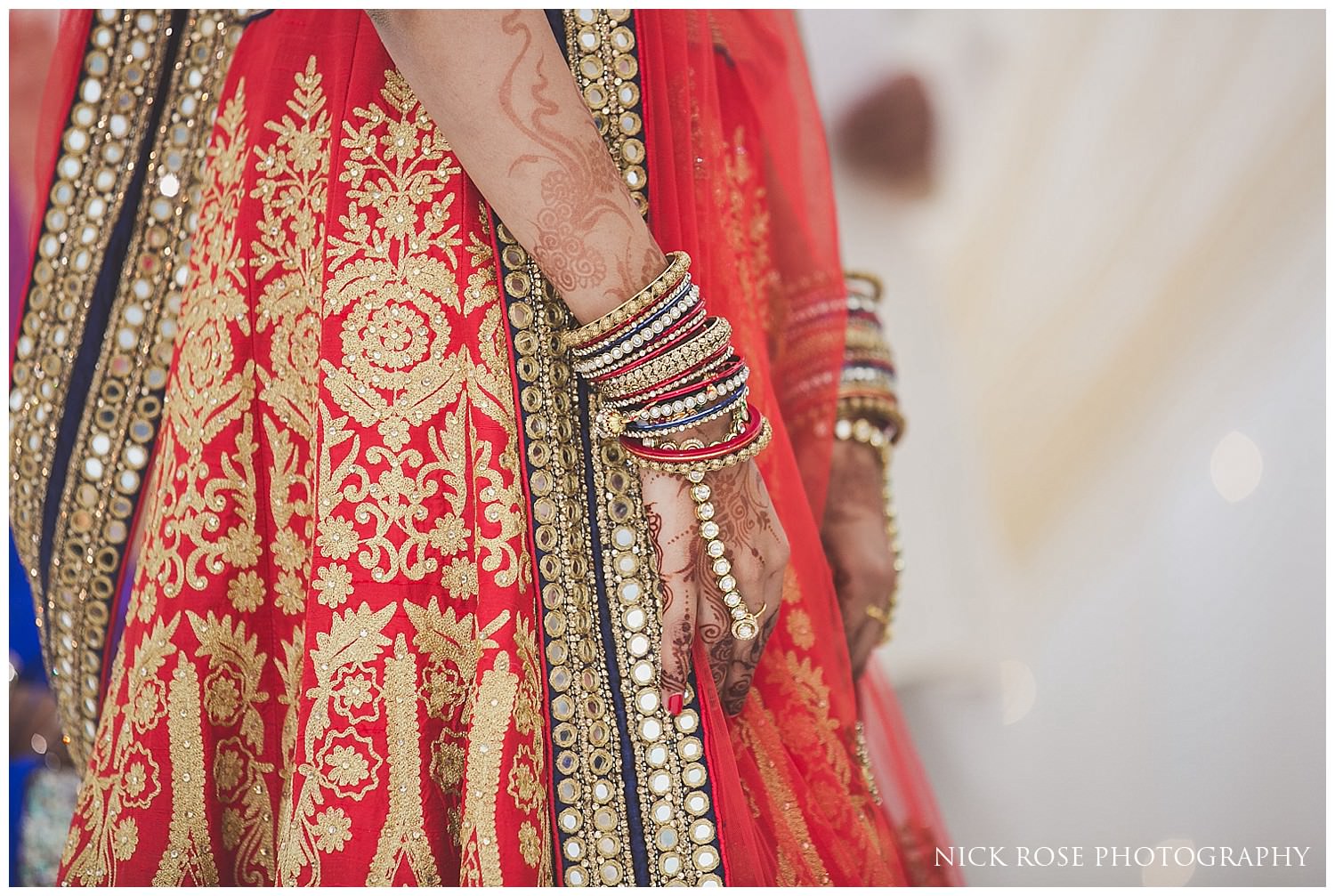  Brides hands with mehndi and bangles during a London Hindu wedding ceremony 