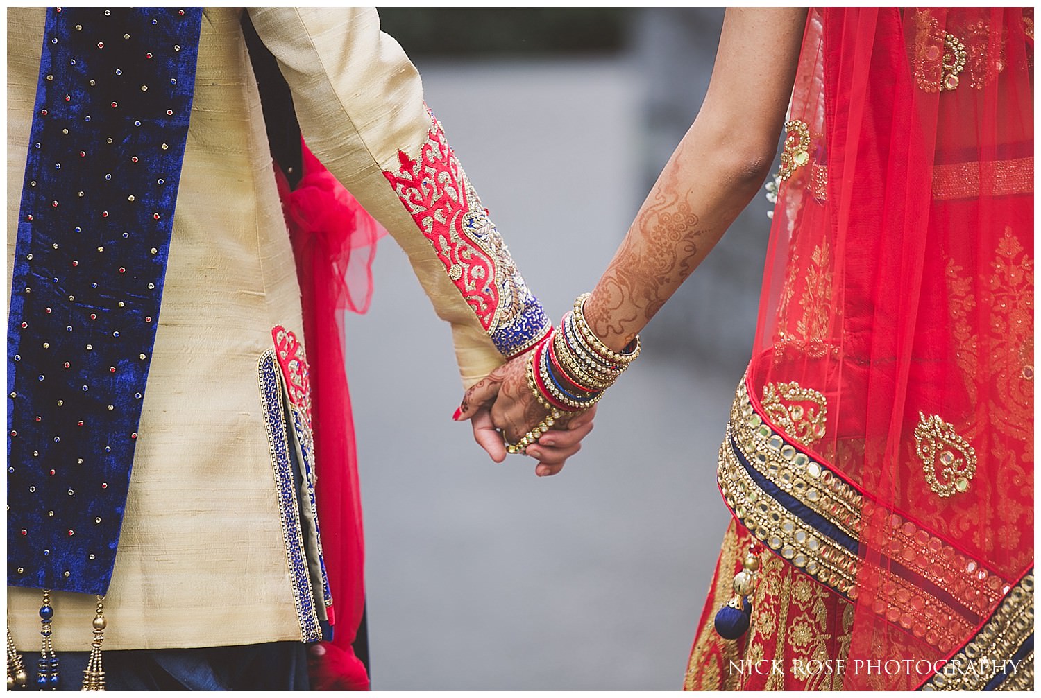  Asian bride and groom holding hands in Canary Wharf London 