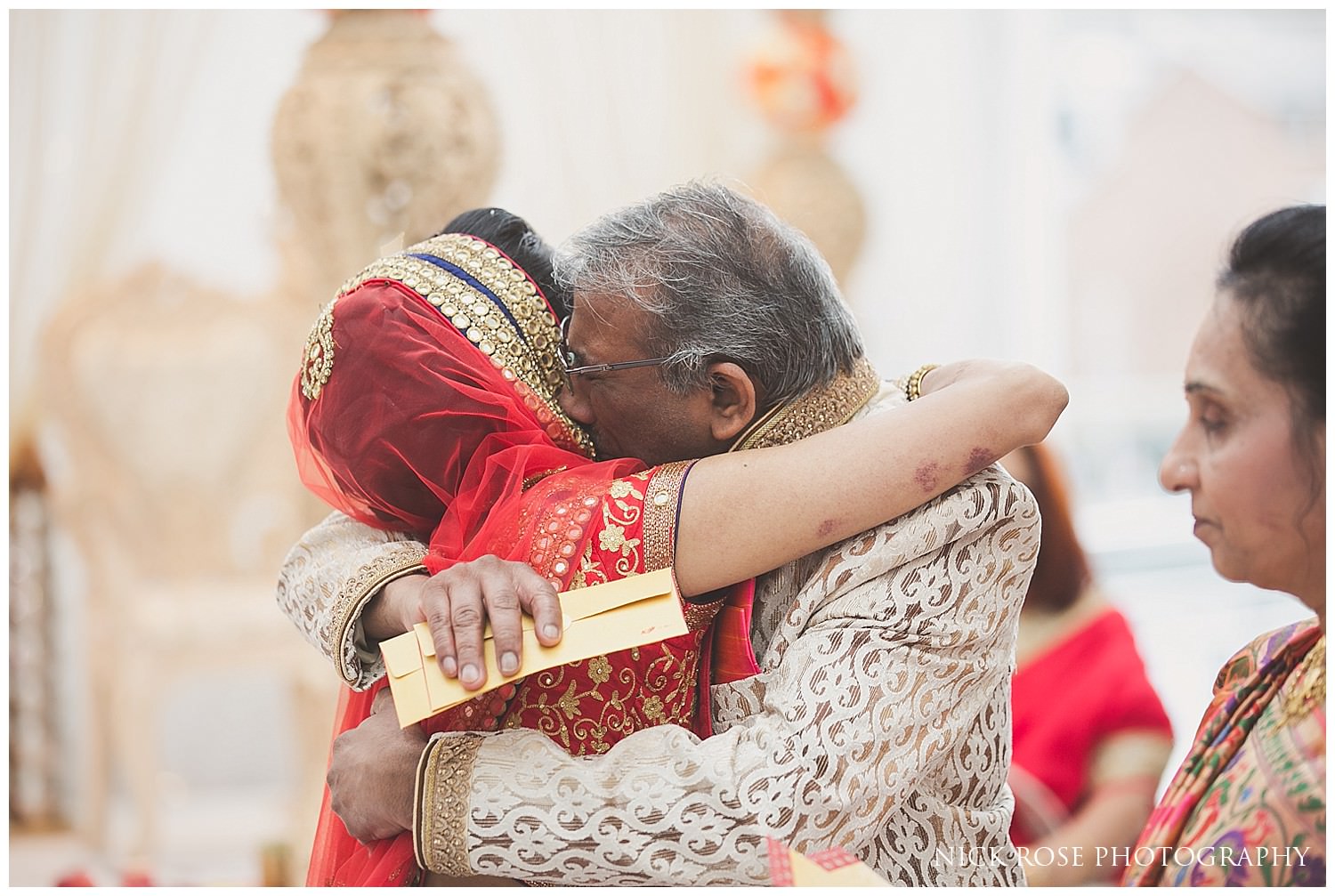 Brides father and bride's emotional farewell during the Hindu wedding viddai at East Wintergarden in London 