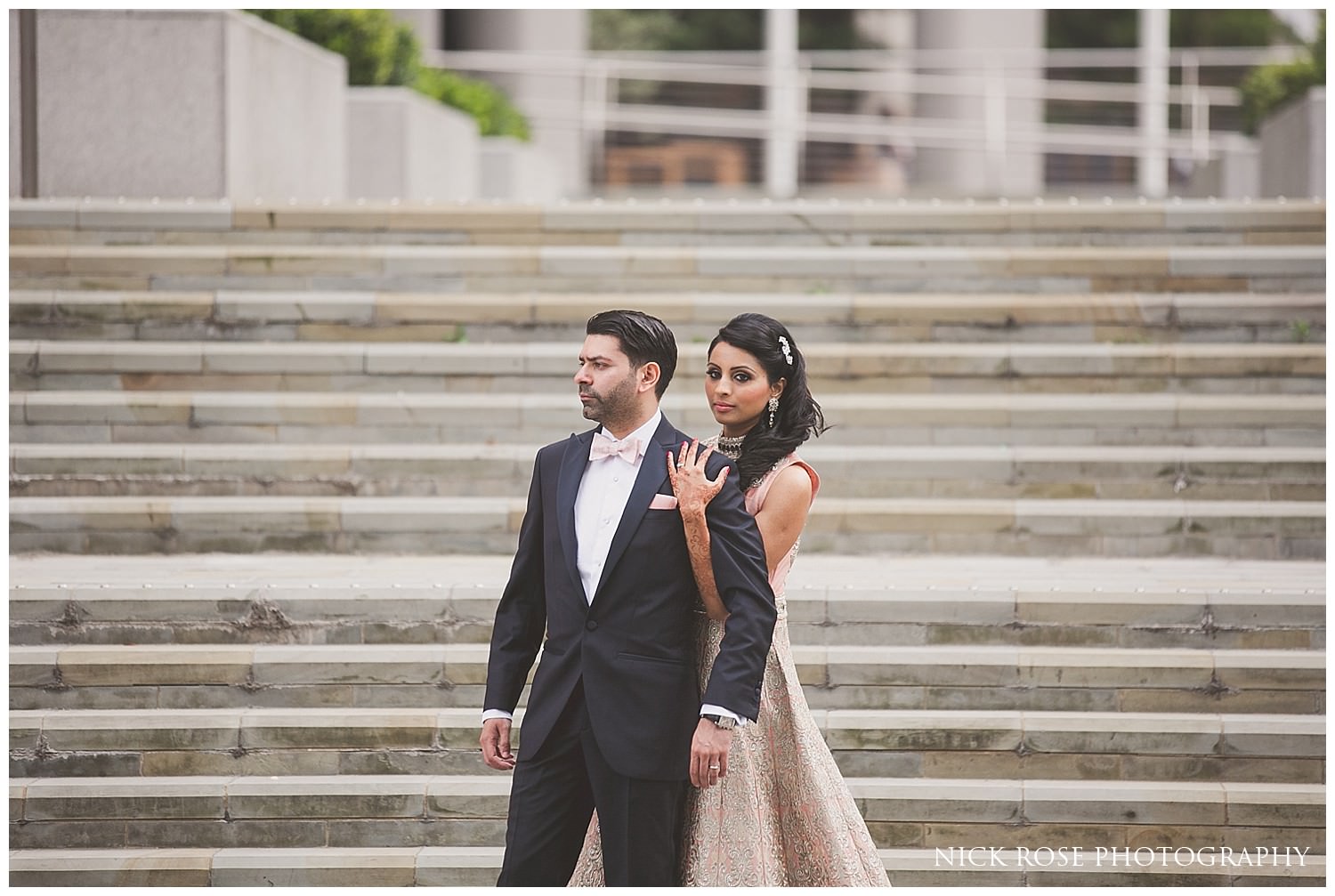  Hindu bride and groom photograph on steps at Canary Wharf in London 