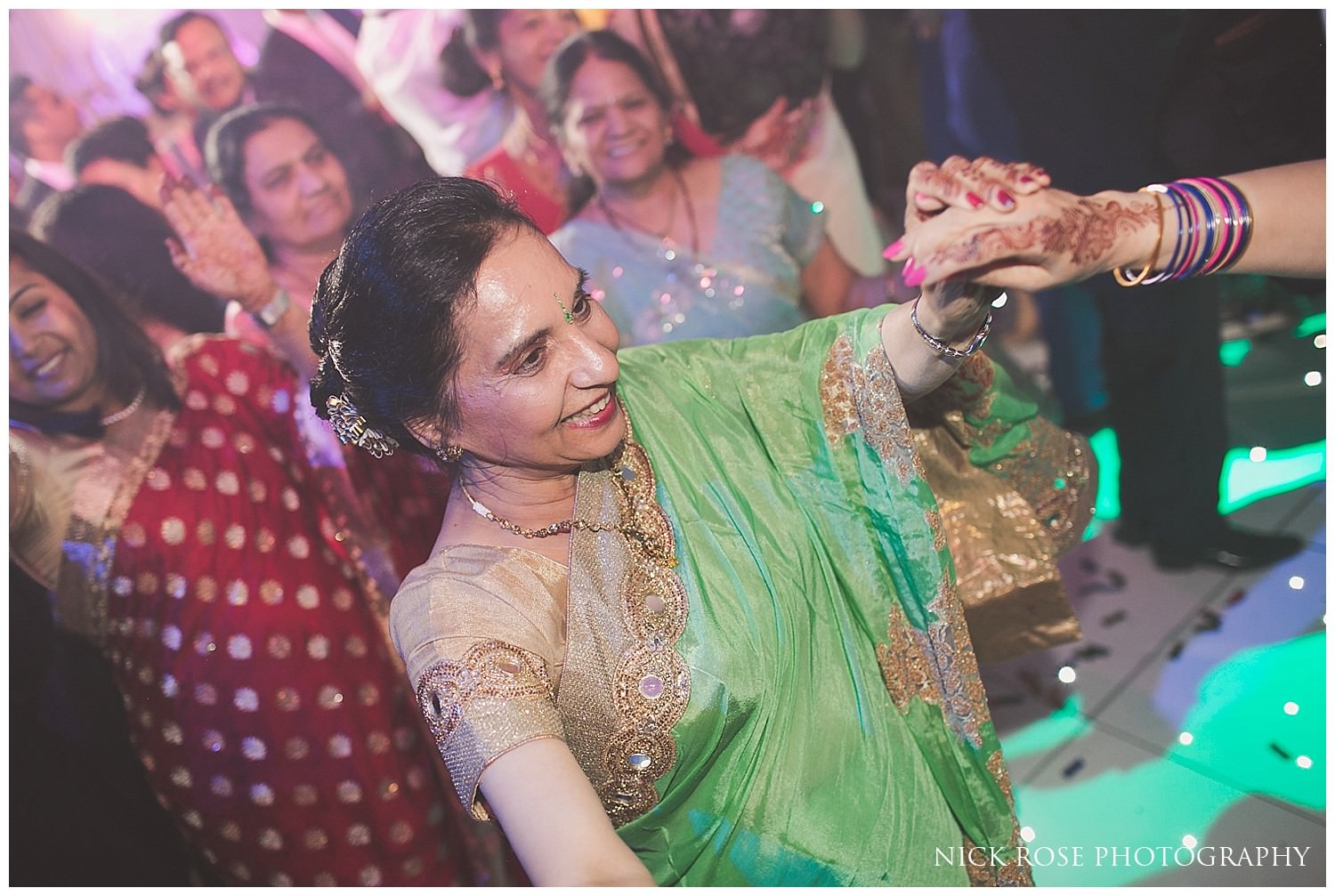  Hindu wedding dancing at Indian wedding reception in Canary Wharf London 