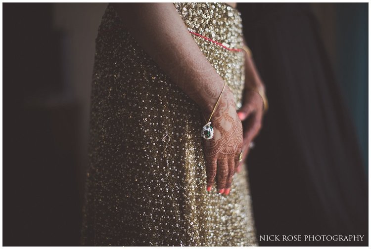  Asian bride with a gold skirt getting ready for a destination Hindu wedding in Dubai at Sofitel Palm 