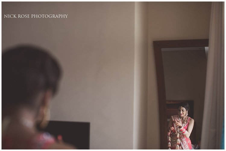 Bride getting dressed for a Hindu beach wedding in Dubai