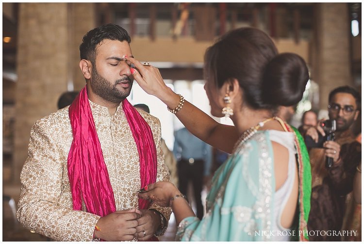  Groom being blessed by Indian relative before a Hindu wedding in Dubai 