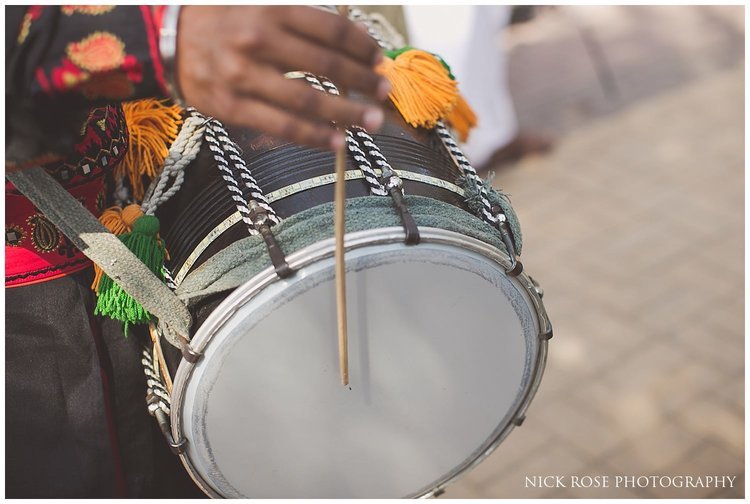  Drums being played for a Hindu wedding entrance at a Sofitel Palm Dubai beach ceremony 