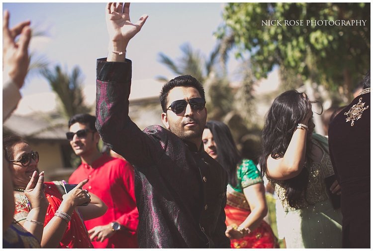  Energetic dancing for an outdoor Hindu wedding Baraat in Dubai 