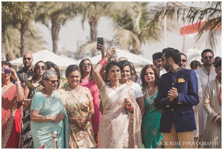  Brides family waiting for the groom to enter a Hindu wedding ceremony at the Sofitel Palm Dubai 