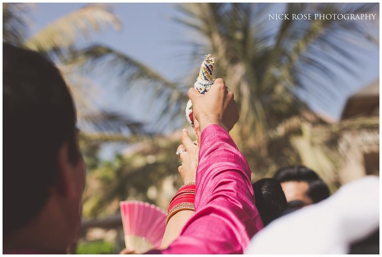  Hindu priest Kamal Pandey greeting the groom at a destination Indian wedding in Dubai 