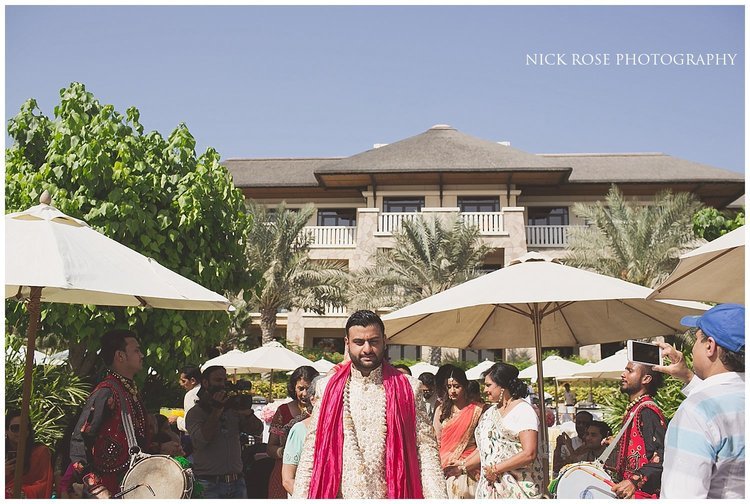 Groom walking to the Hindu mandap for a Sofitel Palm destination wedding in Dubai