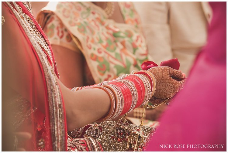  Indian bride holding petals during a Hindu wedding in Dubai 