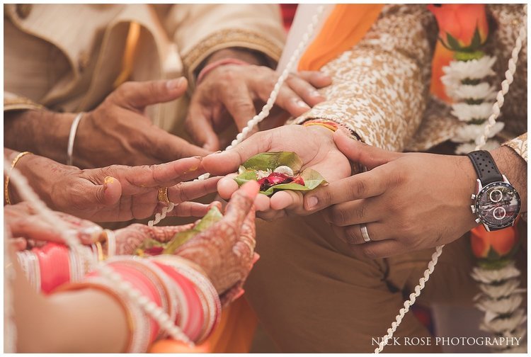 close up photograph of wedding couples hands during a Hindu wedding ceremony in Dubai