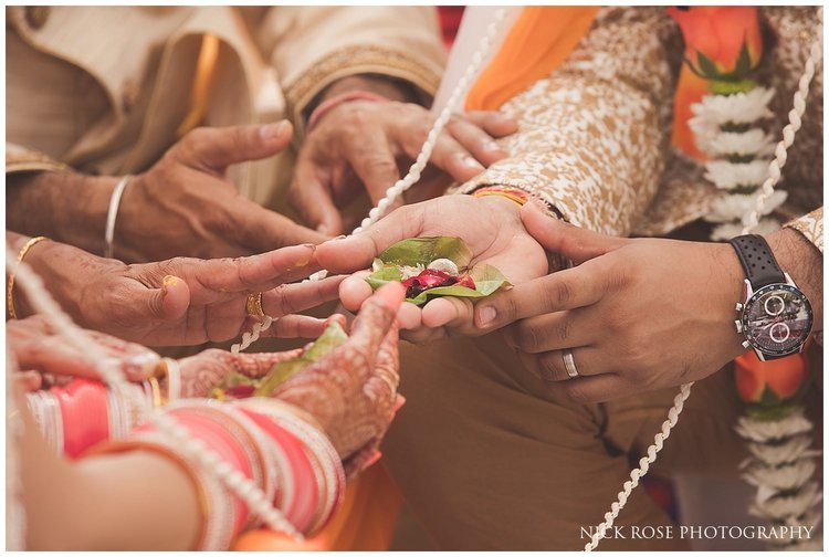  close up photograph of wedding couples hands during a Hindu wedding ceremony in Dubai 