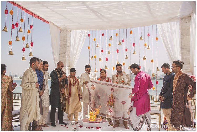  Asian wedding taking place on the beach of the Sofitel Palm Dubai 