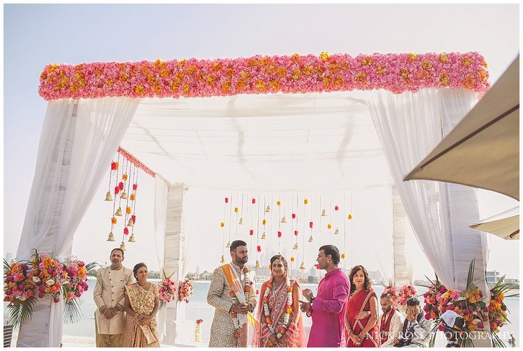  Asian couple getting married under a Mandap for an Indian wedding in Dubai 