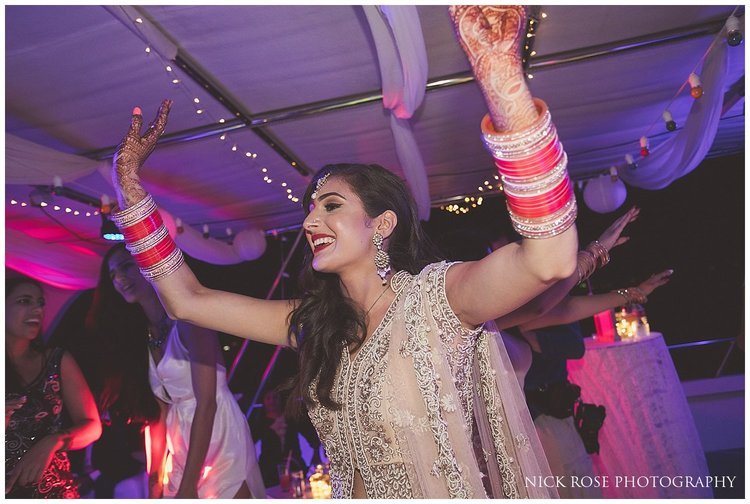  Bride with her hands in the air at a destination wedding in Dubai 