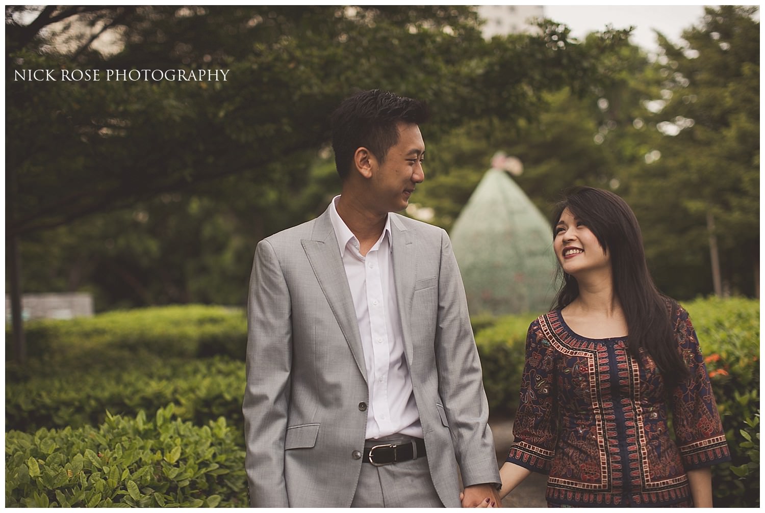  Pre wedding couple holding hands and looking at each other during a Singapore pre wedding photography shoot at Marina Bay 