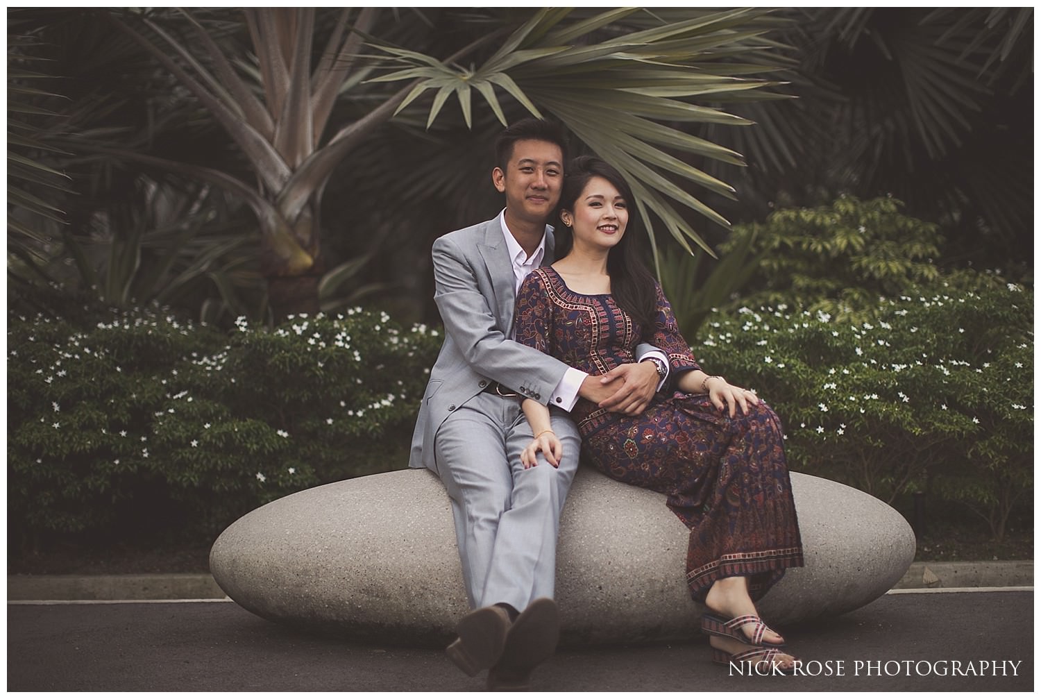  Singapore couple sitting on a rock during a pre wedding photography shoot at Garden by the Bay in Singapore 