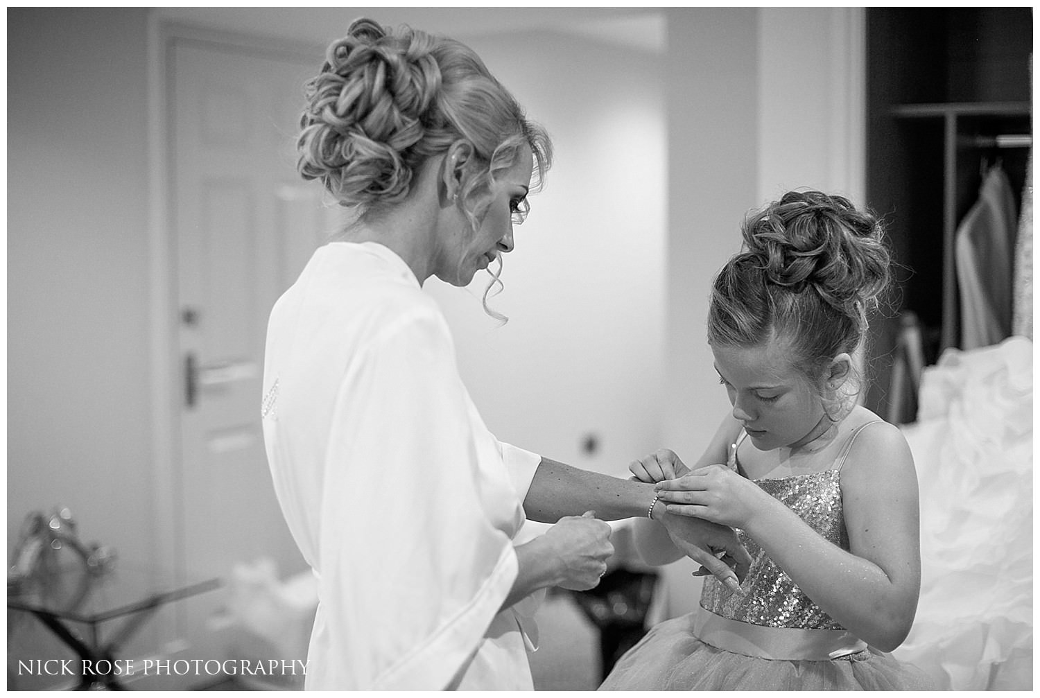  Brides daughter putting a bracelet on the bride before a wedding ceremony at St Mary's Church in Tickhill &nbsp; 