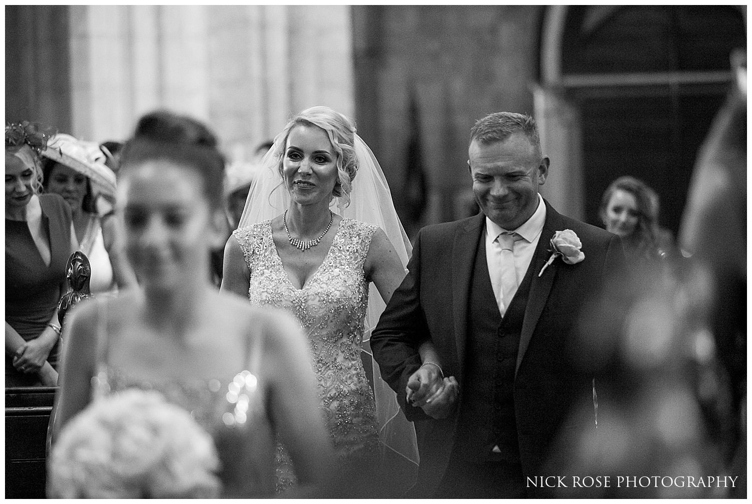  Bride walking down the aisle in St Mary's Church in Tickhill 