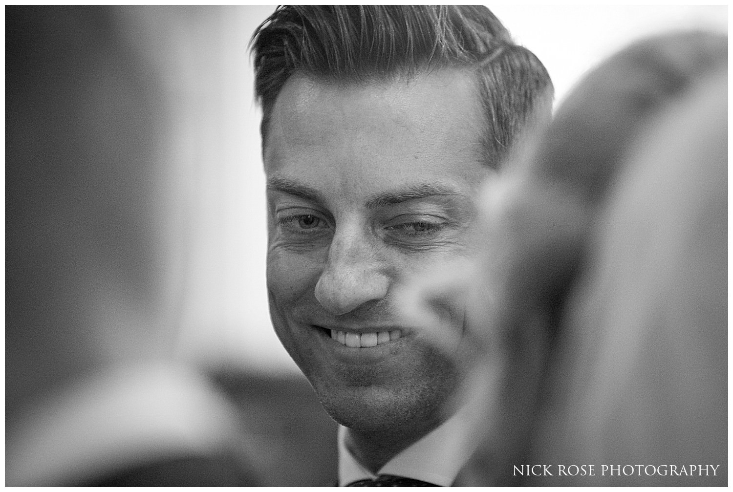  Groom looking at bride during a south Yorkshire wedding ceremony at St Mary's Church 