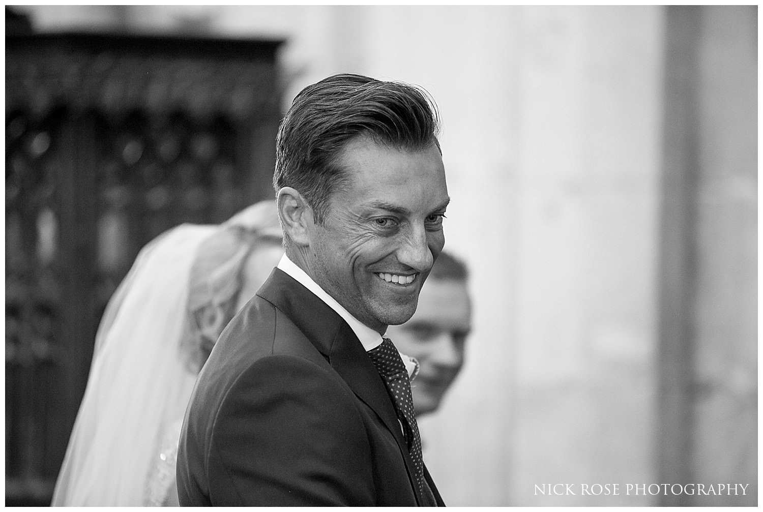  Groom smiling during the wedding ceremony in St Mary's church in Tickhill 
